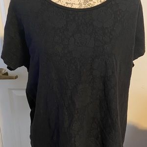 Blank shirt with lace patter on the front.